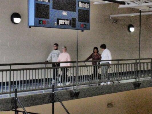 Walking/jogging track suspended above the 3 basketball courts.