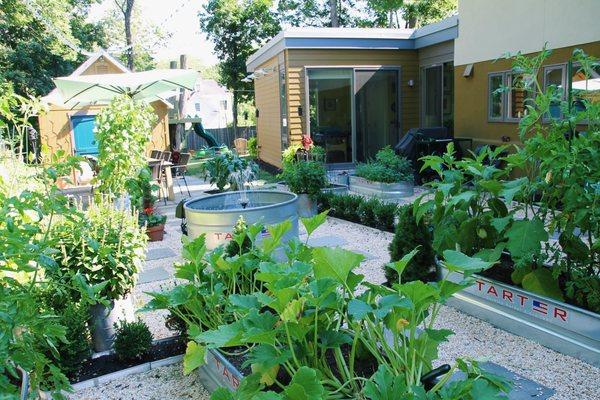 Vibrant garden leading to treatment suite