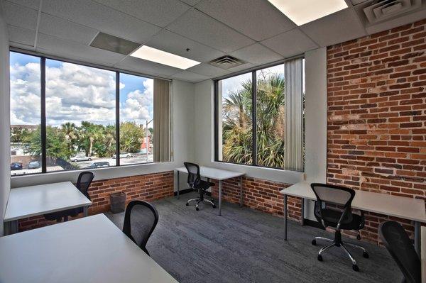 A lofty corner space level with the palm trees! Room for 6!