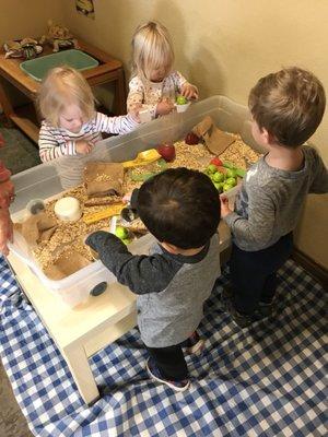 Sensory bins add to the learning with scooping, sorting, and textures