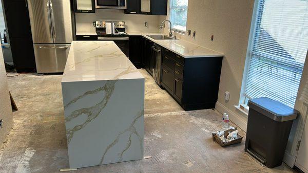 Beautiful kitchen and island with a waterfall.