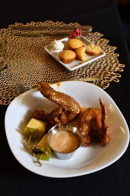 VIP Gold Dusted Wings with homemade cornbread with drizzled honey