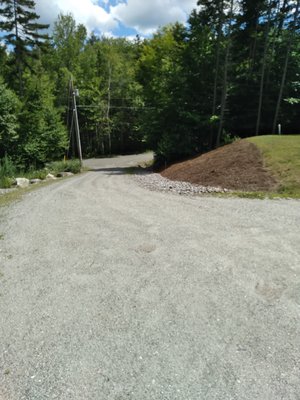 Weeded hillside and raked to refresh.