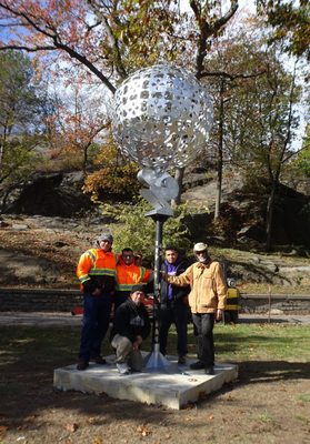 Installation crew assisted artist Jorge Luis Rodriguez with his artowrk at a NYC park