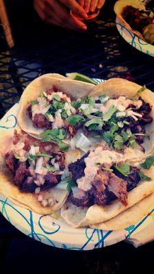 Slow cooked pork, and BBQ'D steak goat and lamb tacos (clockwise from top left).