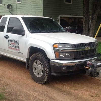 Service truck fully equipped for roadside assistance and winch outs.