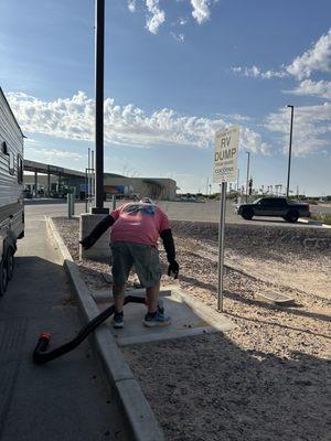 The dump station is around back near the car wash and located near truck parking.