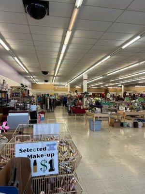 Great day for shopping. Lovely group volunteering to put out more donations on the racks.