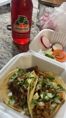 Carnitas and pastor tacos with Jarritos