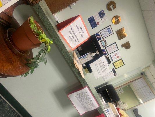 What's in this photo?? NOTHING but an empty front desk because this place is a joke when it comes to professionalism.