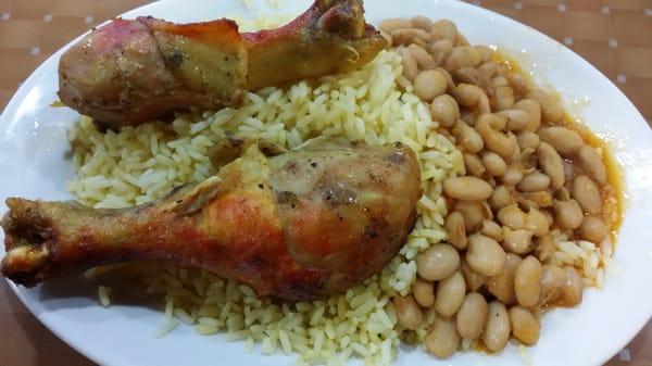 Chicken legs, yellow rice, and beans.