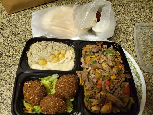 Station Platter: hummus, baba ghanoush, falafel, shawarma, rice, salad, sauce, pita