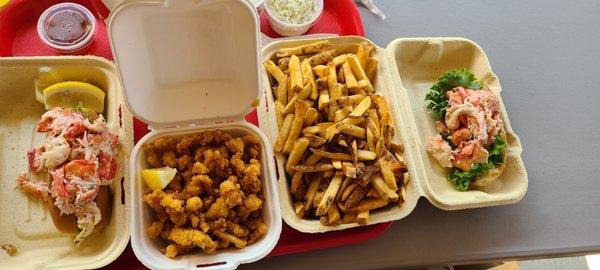 Traditional lobster roll, fries clam strips, fries, and so many sauces