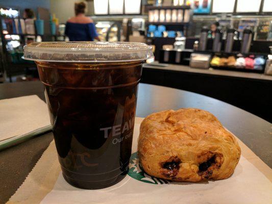 Cold brewed coffee and chocolate croissant. Rating: Standard.