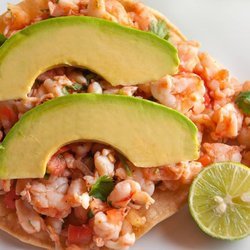 Tostada de Ceviche
 Shrimp Ceviche, marinated in lime juice w/tomato, onion, and cilantro served on a corn tostada & an avocado layer on top