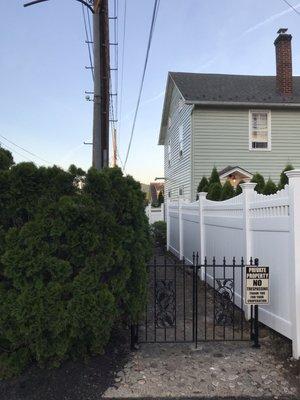 Side of home - they trimmed the arborvitaes and made it work.