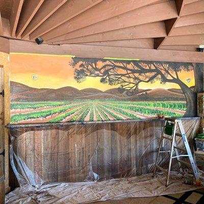 A beautiful iconic Vineyard scene decorates an outdoor cabana.