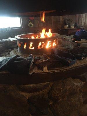 Warm up and dry your gloves off by the fire