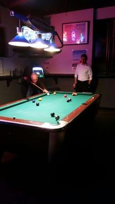 Chuck shooting pool