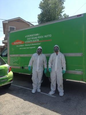 Our SERVPRO of South Austin Technicians in their personal protection equipment cleaning up a biohazard.