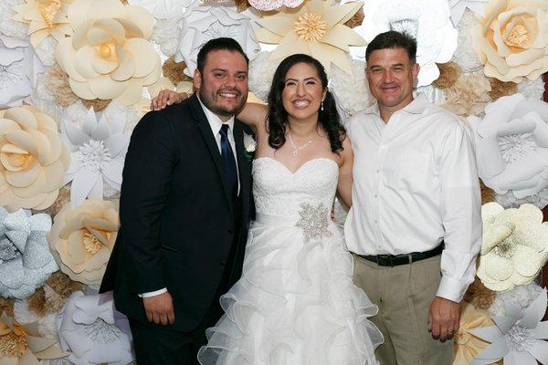 with Clark, the awesome owner in front of a paper flower backdrop done by Nellies Creations set up outside :)