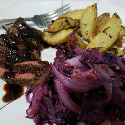 Meat, potatoes, and colorful purple cabbage & onions