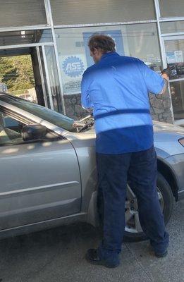 This gentleman cleans your windshield well!