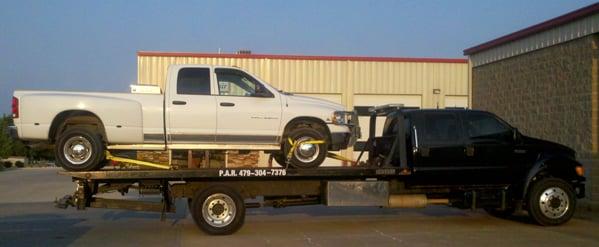 Professional and safe towing using a rollback.