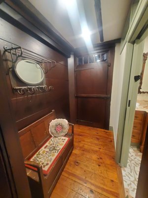 remodeled antique hallway with matched stain work and newly exposed ceiling beams with new sheetrock...