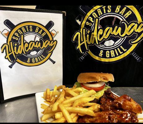 Mouth-watering 6 piece Love Sauce Wings and CHeeseburger with a side of fries