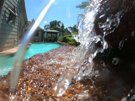 Imagine sipping a margarita and listening the the waterfall in your freshly cleaned pool.