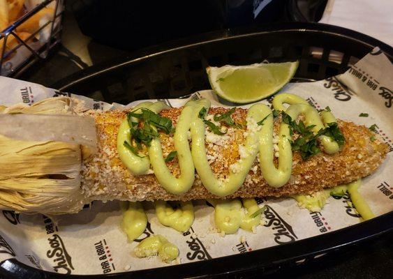 Smoked elote ($8): corn on the cob with avocado aioli, cotija cheese, paprika, and cilantro