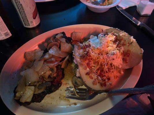 Strip steak with onions and mushrooms.  Loaded baked potato.