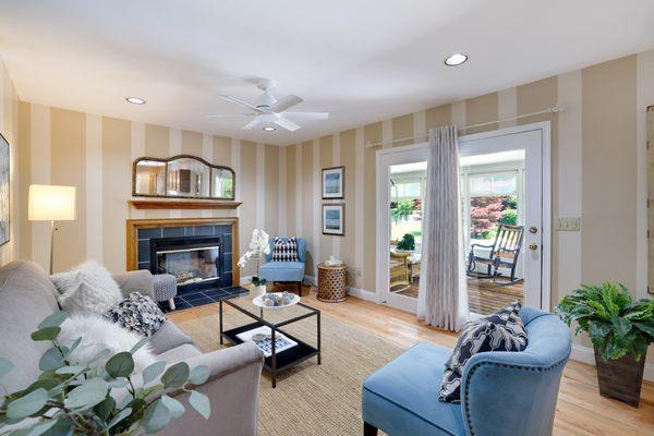 Enjoy the Game with a wood burning Fireplace and easy access to the sunroom.