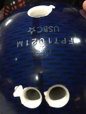 Damaged bowling ball by ball return