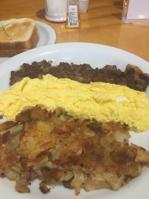 Scrambled Eggs, homemade brisket, homemade potatoes, w/toast.