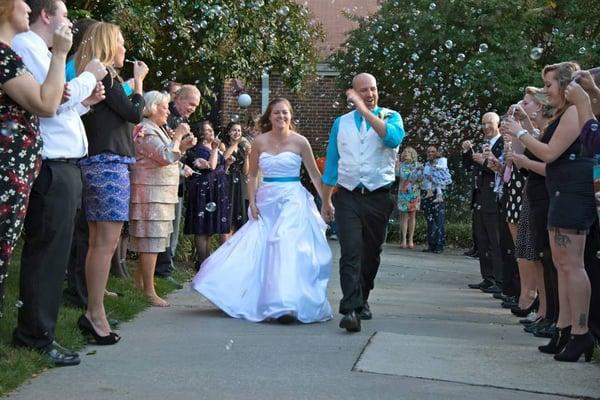 Custom wedding gown and groom's vest.