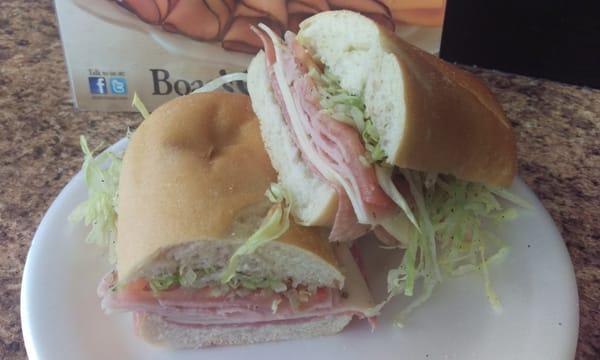 Italian Combo: Ham, salami, provolone cheese, oregano, oil, vinegar, lettuce, tomato on a soft Italian sub