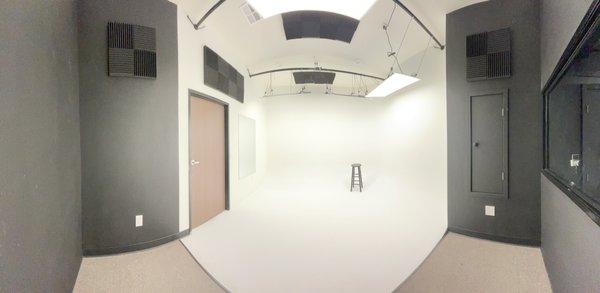 panoramic capture of our infinity wall room with a single stool placed in the corner for perspective.