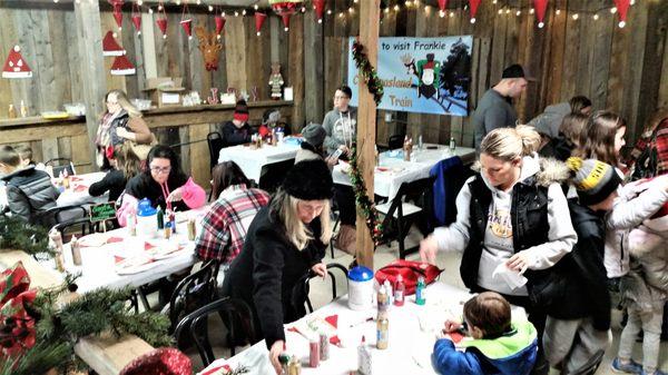 Children being kept busy with crafts.