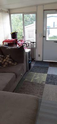 Finished sun room floor with carpet sticky tiles