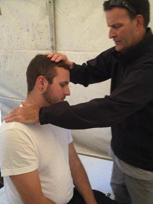 Assessing a "stinger" neck and arm injury in the Med Tent at an international bicycle (cyclocross) race at Roger Williams Park, Providence