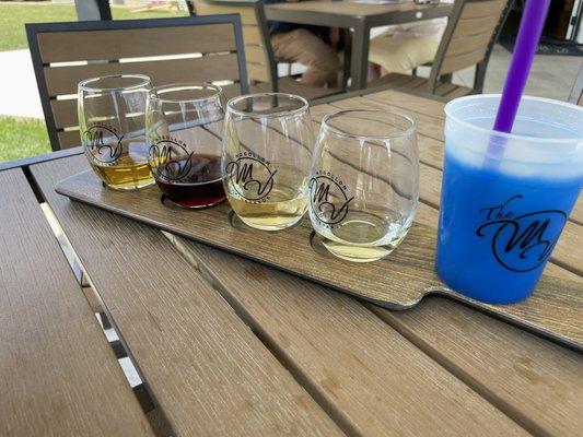 Wine flight. Blue cup is a white wine slushy