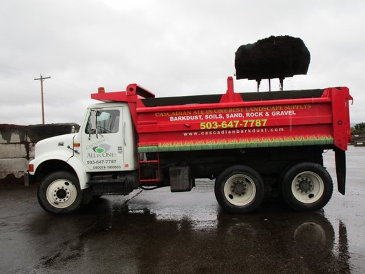 Our smaller delivery truck has a split box, so it can deliver two products in one trip, or up to 8 tons of rock or 11 yards of mulch.