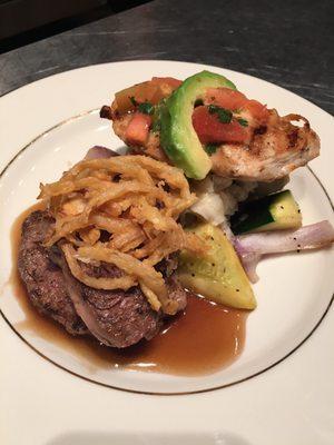 Dual entree meal with chicken and steak plated