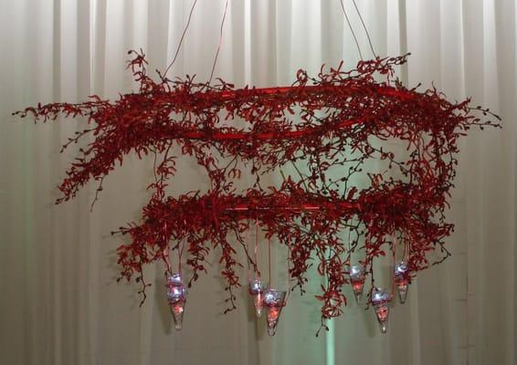 A chandelier made of red orchids.  Seriously.