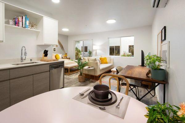 Your apartment features modern european cabinetry, stainless steal appliances, modern light fixtures, quartz countertops