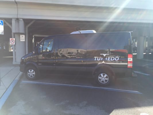 Decals on a TUXEDO shuttle van