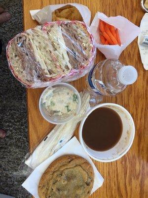 Roast beef au jus with chocolate chip cookie, loaded potato salad, carrots, chips and water