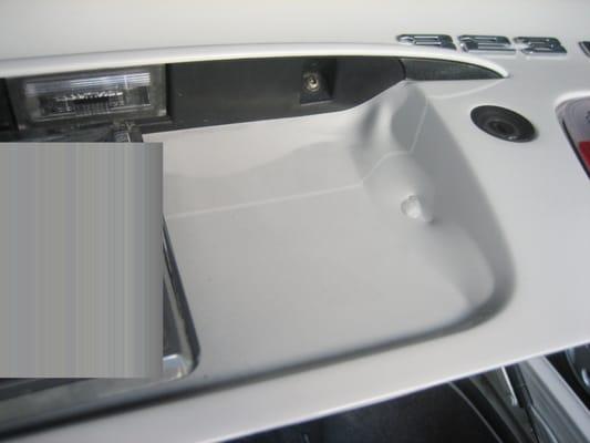 Paint adhesion and bubbling issues on the right side of trunk lid.